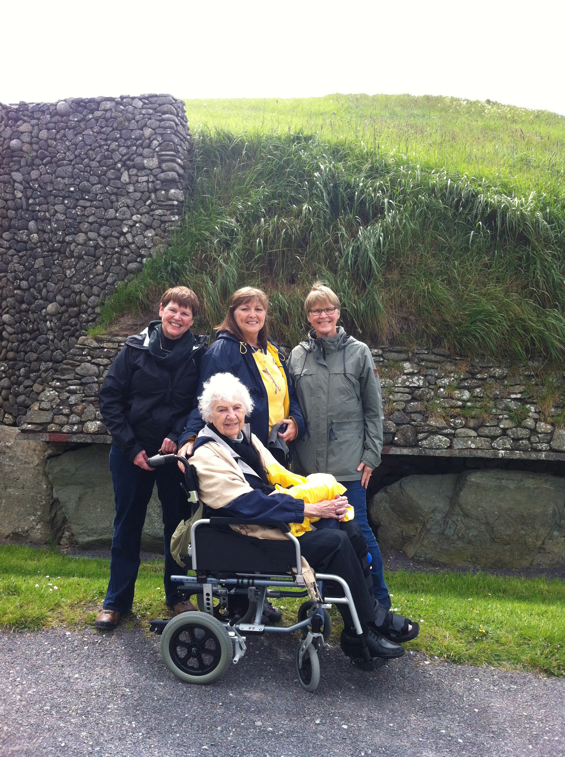 Molly Daniel, Martha Clark, Sara Burrus and Roberta Clark (front) at Newgrange mound at Bru na Boinne. Photo by Annis Householder.